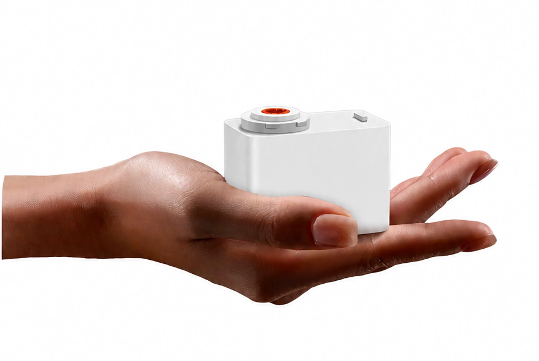 手掌托起白色 JINK Motor Air 窗帘电机，橙色传动接口清晰可见