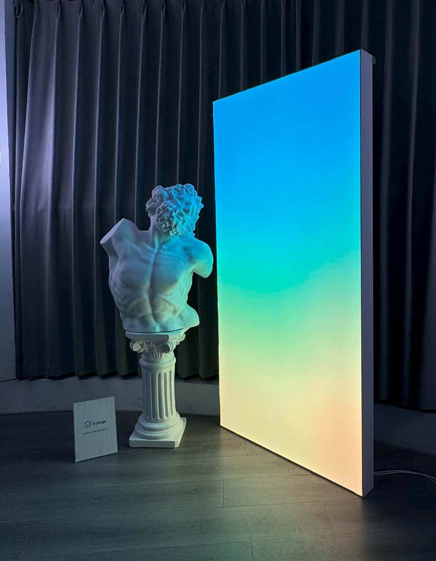 JINK × trytogo Gradient Light Curtain: blue and cyan with a sculpture display